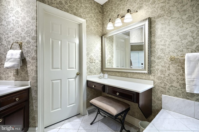 bathroom featuring tile patterned flooring and vanity