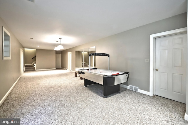 recreation room featuring carpet floors and baseboards