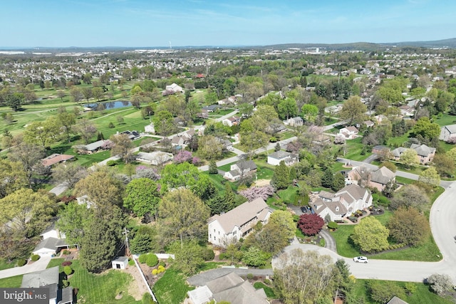 drone / aerial view with a residential view and a water view