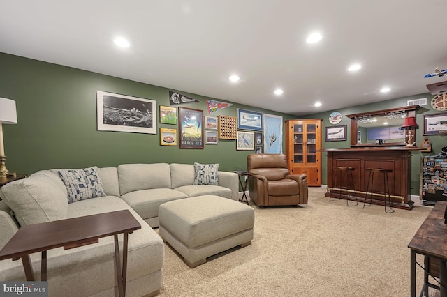 living room with recessed lighting, carpet floors, visible vents, and a dry bar