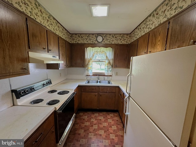 1222 Hoff Rd, Hanover, PA 17331 - kitchen with a sink, freestanding refrigerator, tile patterned floors, under cabinet range hood, and electric range oven