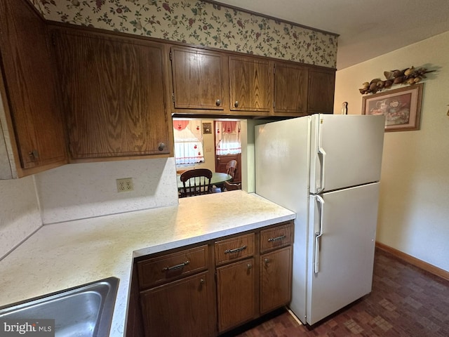 1222 Hoff Rd, Hanover, PA 17331 - kitchen featuring a sink, freestanding refrigerator, baseboards, light countertops, and dark wood-style floors