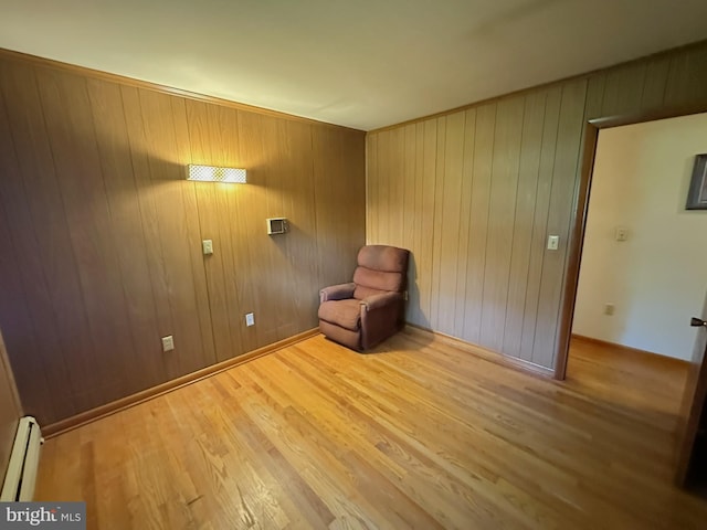 1222 Hoff Rd, Hanover, PA 17331 - unfurnished room with baseboards, baseboard heating, wood walls, and wood finished floors
