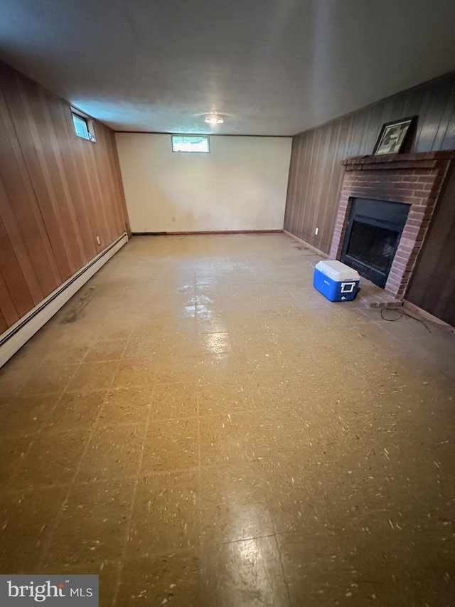 1222 Hoff Rd, Hanover, PA 17331 - below grade area with a baseboard heating unit, a brick fireplace, wood walls, and baseboards