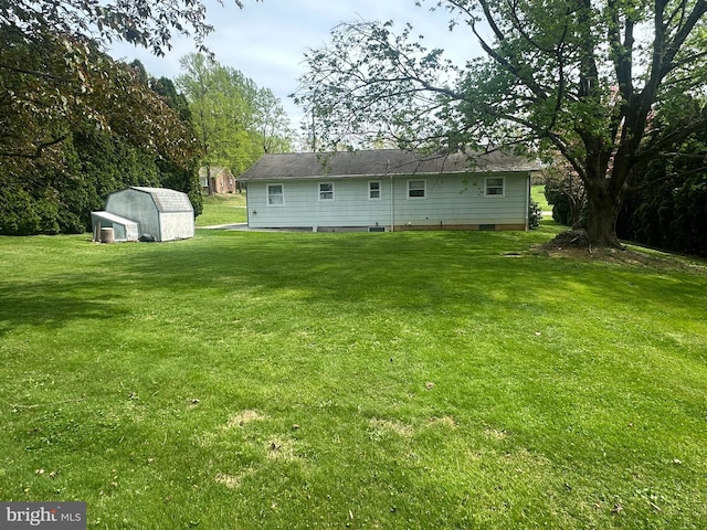 1222 Hoff Rd, Hanover, PA 17331 - rear view of house with a shed, an outbuilding, and a lawn