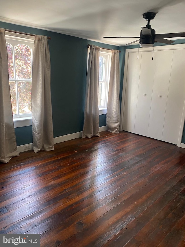 27 E Salisbury St, Williamsport, MD 21795 - unfurnished bedroom with dark wood-style floors, baseboards, and ceiling fan