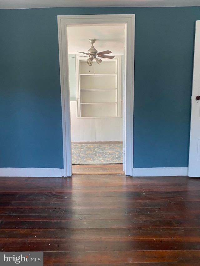 27 E Salisbury St, Williamsport, MD 21795 - empty room with ceiling fan, dark wood-type flooring, and baseboards