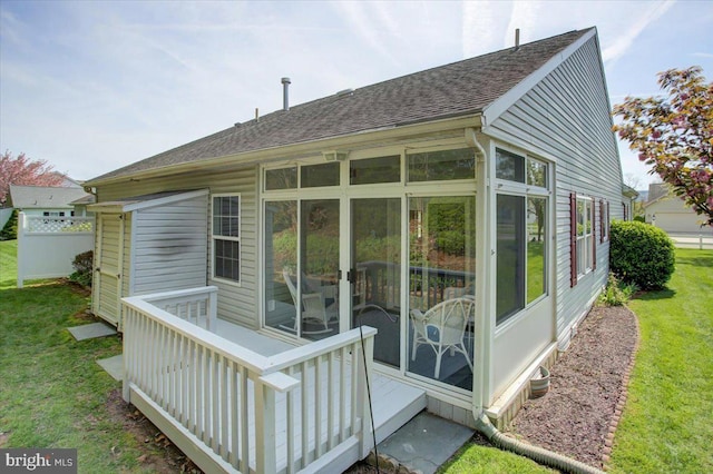 18 Lantern Ln, Shippensburg, PA 17257 - back of house featuring a lawn, a sunroom, and a shingled roof