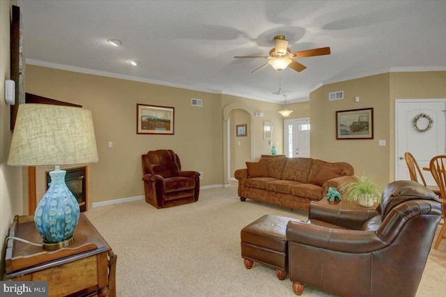 18 Lantern Ln, Shippensburg, PA 17257 - carpeted living room with arched walkways, visible vents, crown molding, and ceiling fan