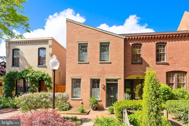 view of front of home featuring brick siding