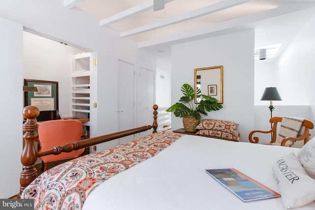 bedroom with beam ceiling
