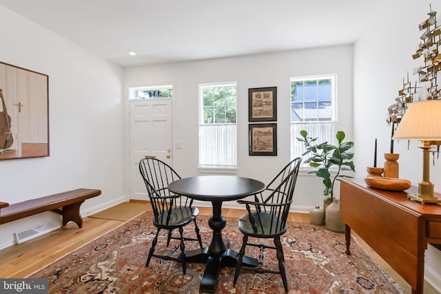 dining space featuring recessed lighting, baseboards, visible vents, and wood finished floors