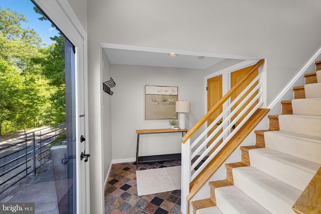 2621 S Arlington Ridge Rd, Arlington, VA 22202 - staircase with recessed lighting, baseboards, stone finish flooring, and a healthy amount of sunlight
