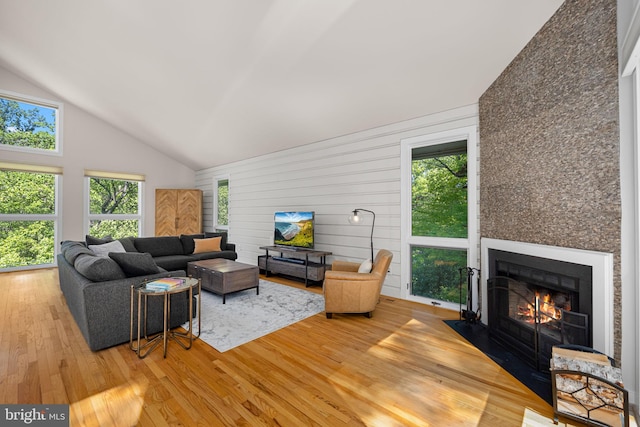 2621 S Arlington Ridge Rd, Arlington, VA 22202 - living room with light wood-style floors, high vaulted ceiling, plenty of natural light, and a fireplace
