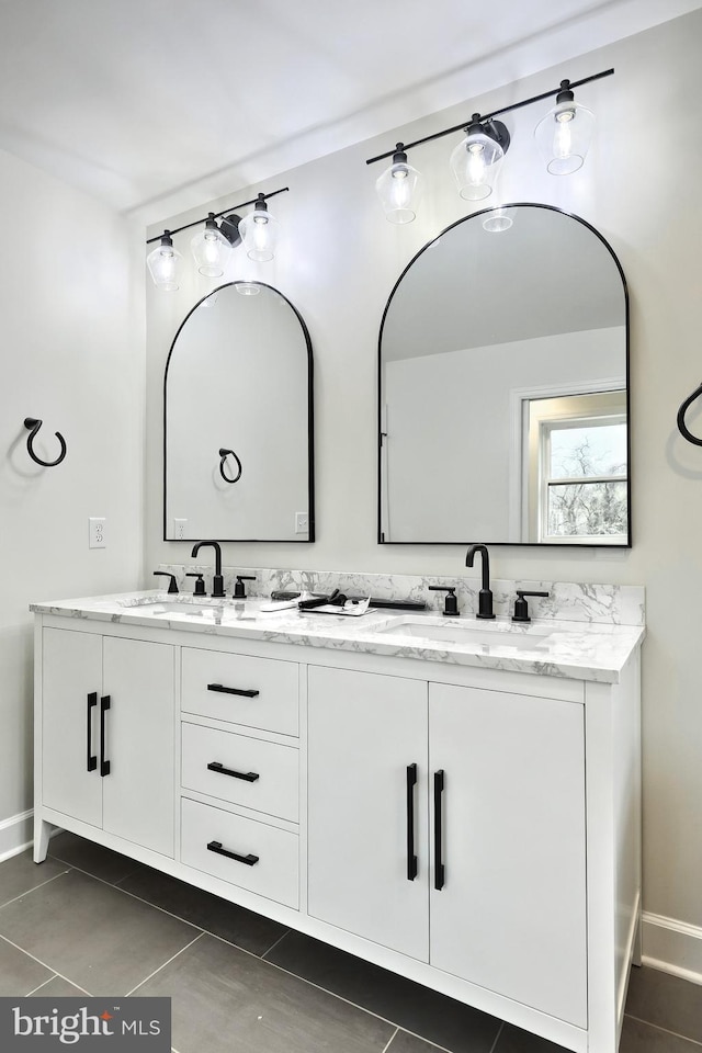 2741 Primrose Ln N, York, PA 17404 - bathroom featuring baseboards, tile patterned flooring, a sink, and double vanity