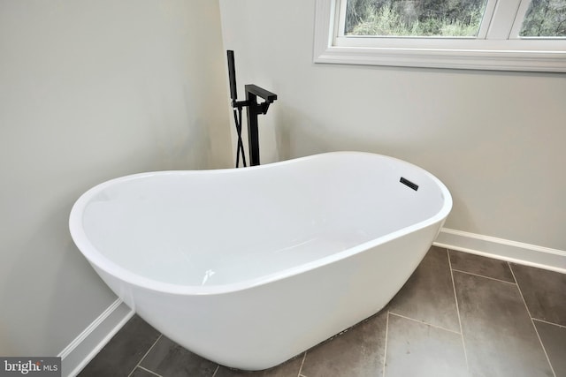 2741 Primrose Ln N, York, PA 17404 - interior details featuring a freestanding bath and baseboards