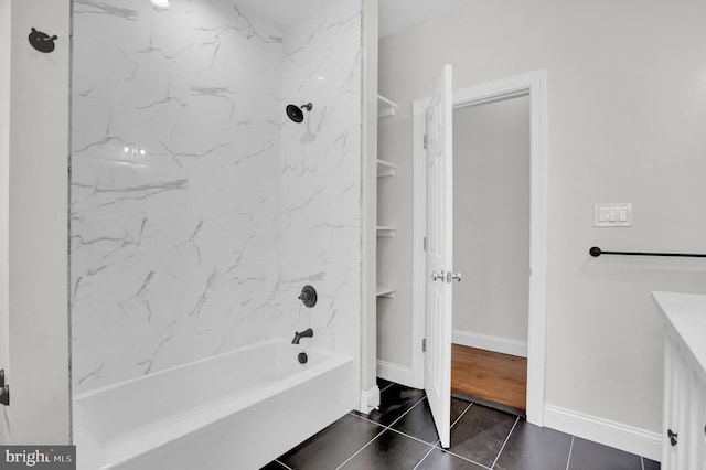 full bath with tile patterned floors, baseboards, and shower / bathtub combination