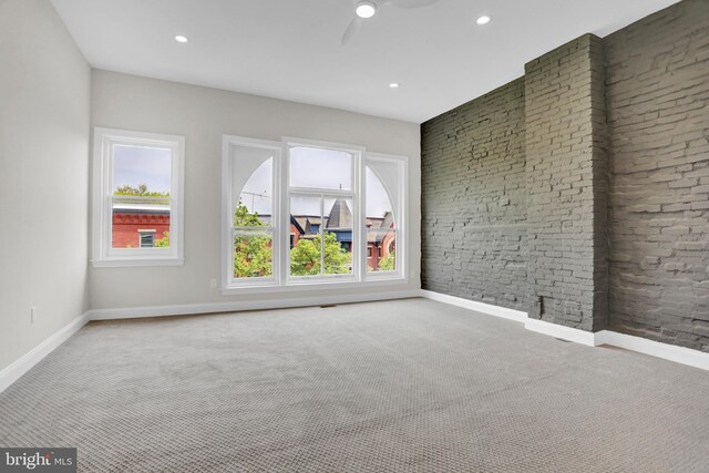 carpeted spare room with recessed lighting, a ceiling fan, and baseboards