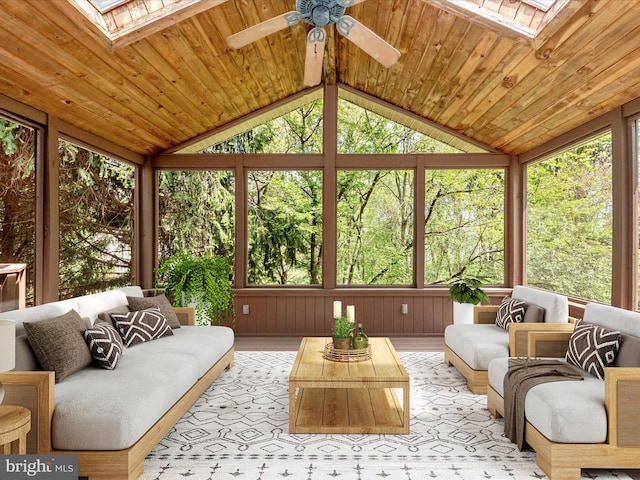 sunroom / solarium featuring an outdoor hangout area, a ceiling fan, and wood finished floors