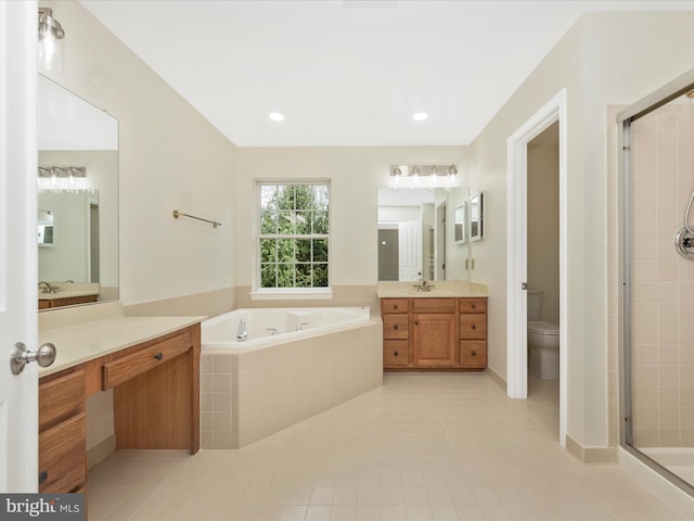 full bath with a garden tub, tile patterned floors, a stall shower, vanity, and toilet