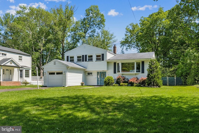 76 Briarwood Dr E, Berkeley Heights, NJ 07922 - tri-level home with a chimney, a garage, and driveway