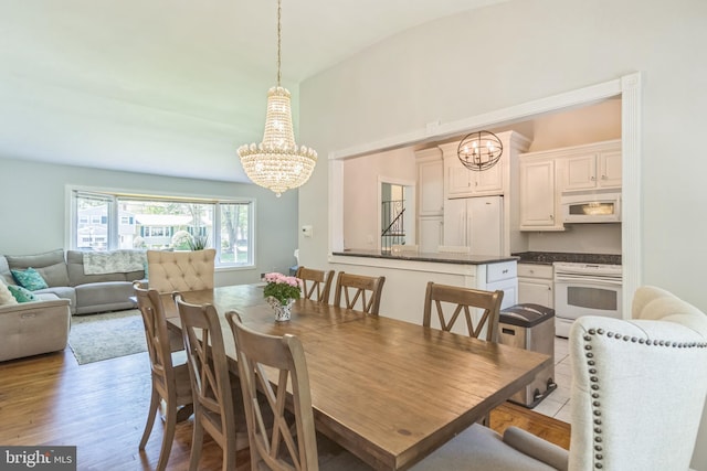76 Briarwood Dr E, Berkeley Heights, NJ 07922 - dining room with a chandelier and light wood-style flooring