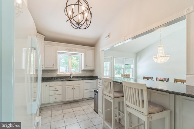 76 Briarwood Dr E, Berkeley Heights, NJ 07922 - kitchen with a chandelier, vaulted ceiling, a breakfast bar, light tile patterned floors, and white appliances