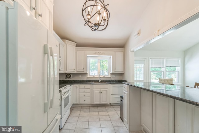 76 Briarwood Dr E, Berkeley Heights, NJ 07922 - kitchen featuring white appliances, white cabinetry, a chandelier, light tile patterned floors, and a sink