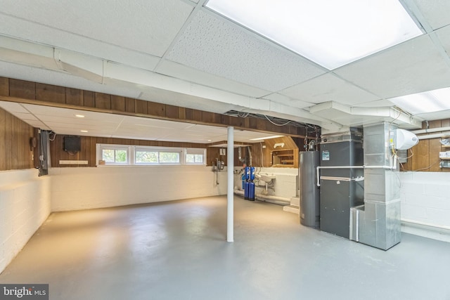 76 Briarwood Dr E, Berkeley Heights, NJ 07922 - below grade area featuring concrete block wall, water heater, heating unit, and a drop ceiling