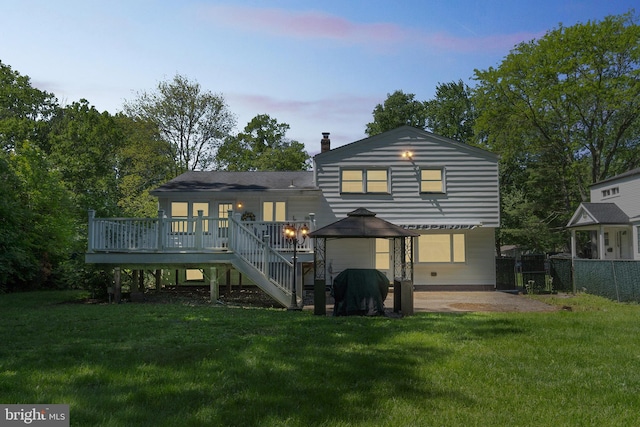 76 Briarwood Dr E, Berkeley Heights, NJ 07922 - back of property at dusk featuring a deck, a chimney, a patio area, and stairway