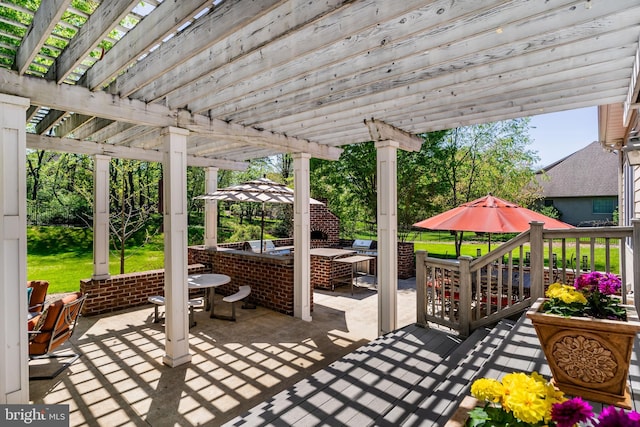 view of patio / terrace with outdoor dining area, a pergola, and an outdoor hangout area