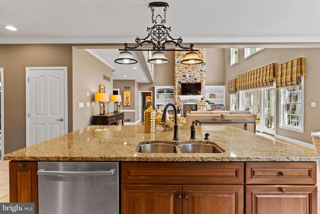 kitchen featuring visible vents, crown molding, dishwasher, a sink, and open floor plan