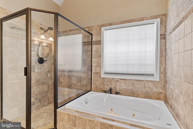 bathroom featuring a whirlpool tub and a stall shower