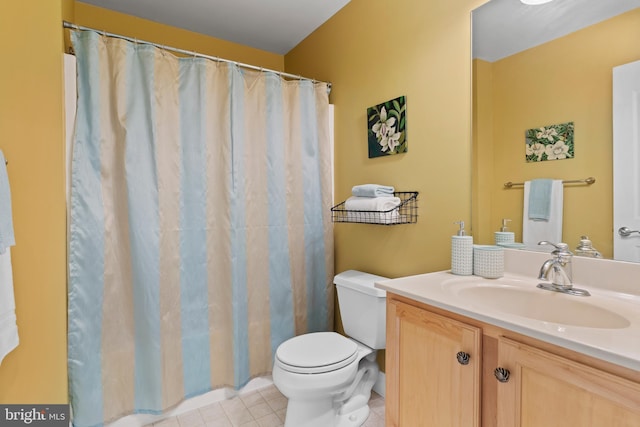 bathroom with vanity, tile patterned floors, toilet, and a shower with shower curtain