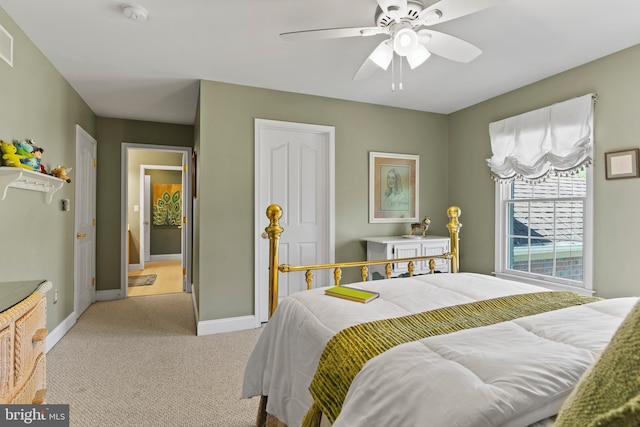 bedroom featuring baseboards, light colored carpet, ceiling fan, and visible vents