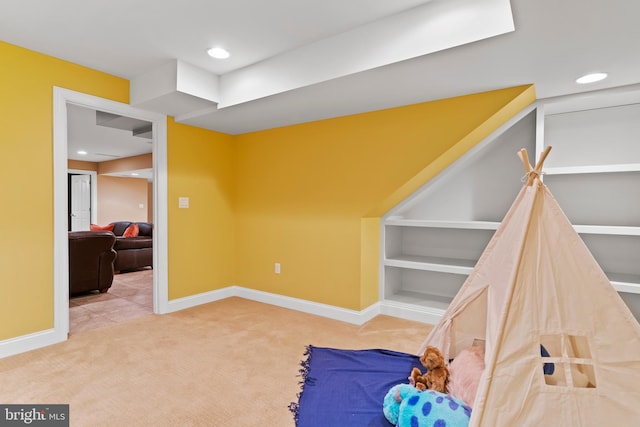living area with carpet flooring, recessed lighting, and baseboards