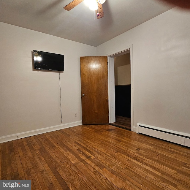 unfurnished bedroom featuring hardwood / wood-style floors, baseboards, and ceiling fan