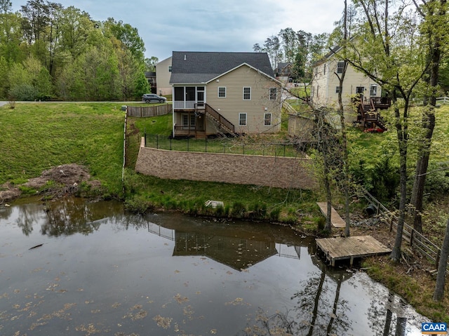 6348 Flintstone Dr, Barboursville, VA 22923 - back of property with a sunroom, fence, a yard, and stairway