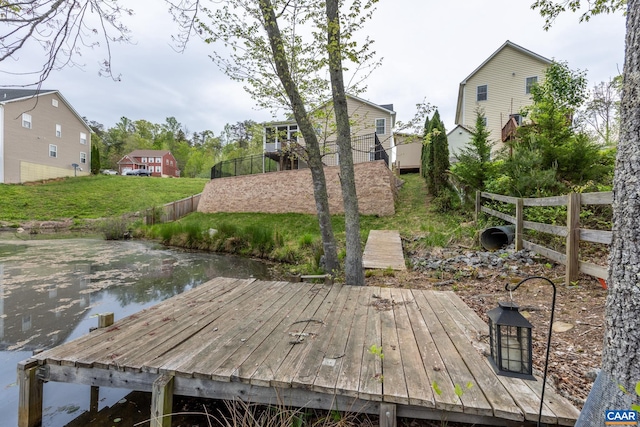6348 Flintstone Dr, Barboursville, VA 22923 - view of dock featuring a lawn, fence, and a wooden deck