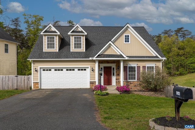 6348 Flintstone Dr, Barboursville, VA 22923 - view of front facade with a shingled roof, aphalt driveway, fence, and stone siding