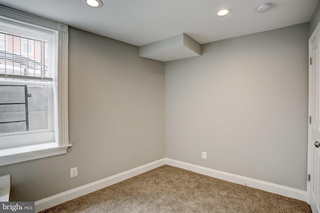 interior space featuring carpet flooring, baseboards, and recessed lighting