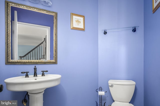 half bath featuring toilet