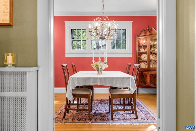 2616 Jefferson Park Cir, Charlottesville, VA 22903 - dining space with wood finished floors, crown molding, baseboards, and a notable chandelier