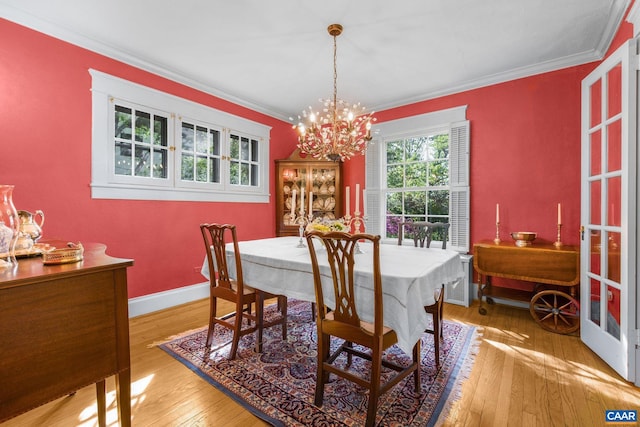2616 Jefferson Park Cir, Charlottesville, VA 22903 - dining room featuring baseboards, ornamental molding, a chandelier, and hardwood / wood-style floors