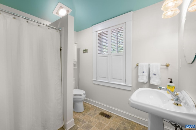 2616 Jefferson Park Cir, Charlottesville, VA 22903 - full bathroom featuring visible vents, toilet, a sink, stone finish flooring, and baseboards