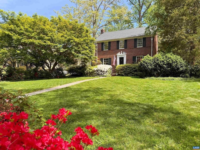 2616 Jefferson Park Cir, Charlottesville, VA 22903 - colonial home with a chimney, brick siding, and a front yard