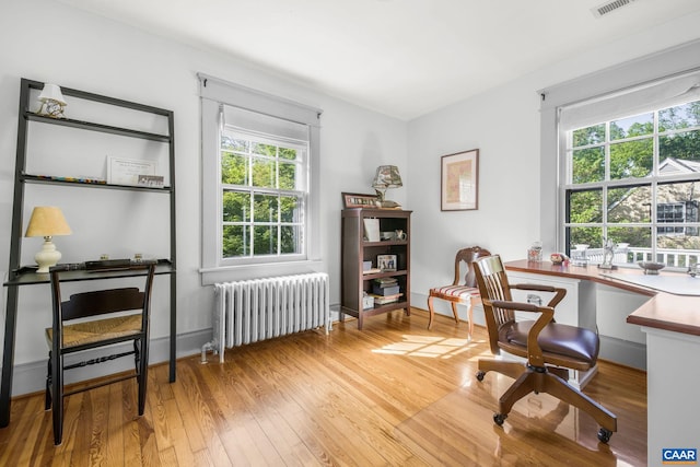 2616 Jefferson Park Cir, Charlottesville, VA 22903 - office featuring radiator heating unit, light wood-style flooring, and visible vents