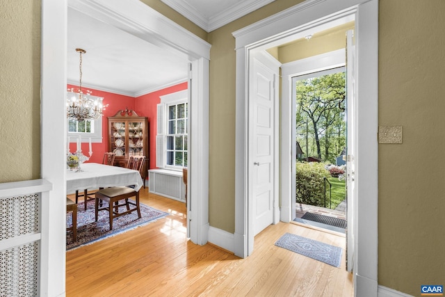 2616 Jefferson Park Cir, Charlottesville, VA 22903 - entrance foyer with wood finished floors, baseboards, ornamental molding, and an inviting chandelier