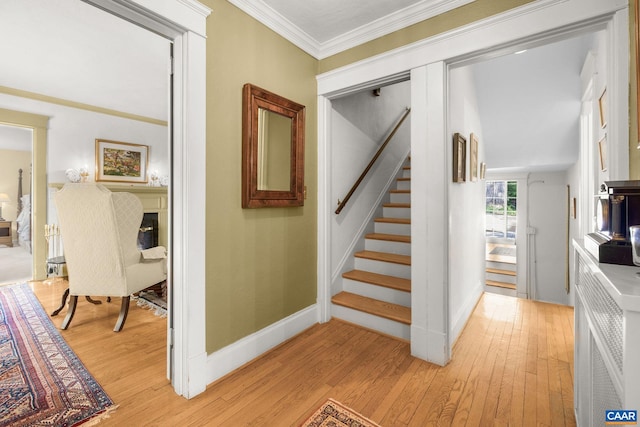 2616 Jefferson Park Cir, Charlottesville, VA 22903 - stairs with a fireplace, wood finished floors, baseboards, and ornamental molding