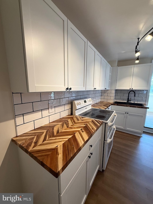 427 S Market St, Frederick, MD 21701 - kitchen featuring dark wood-style floors, a sink, double oven range, backsplash, and butcher block countertops